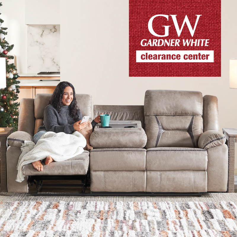 Woman relaxing on a power reclining sofa