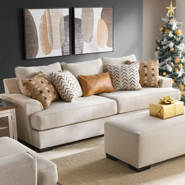 Beige contemporary sofa in a modern styled Christmas room