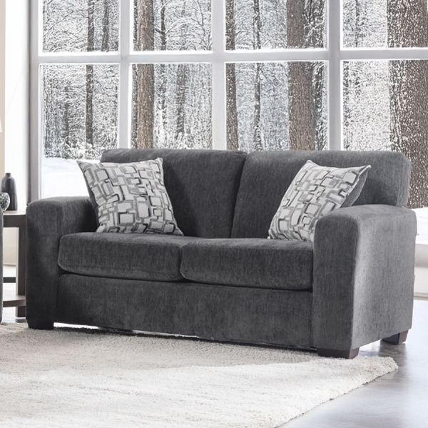 Presley loveseat in front of picture window in winter