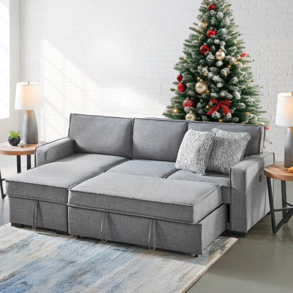 Sleeper sofa with a decal of tree on the wall because it sure couldn't actually fit there