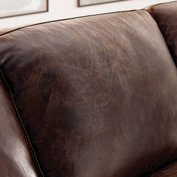 Back cushion of a sofa in leather