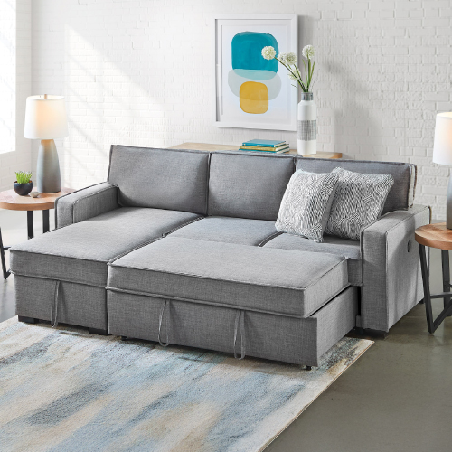 Grey sleeper sofa with toss pillows