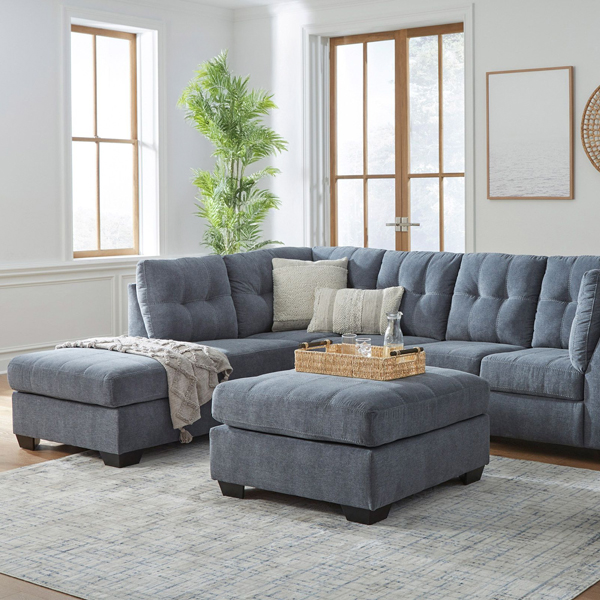 Blue sectional with blue ottoman