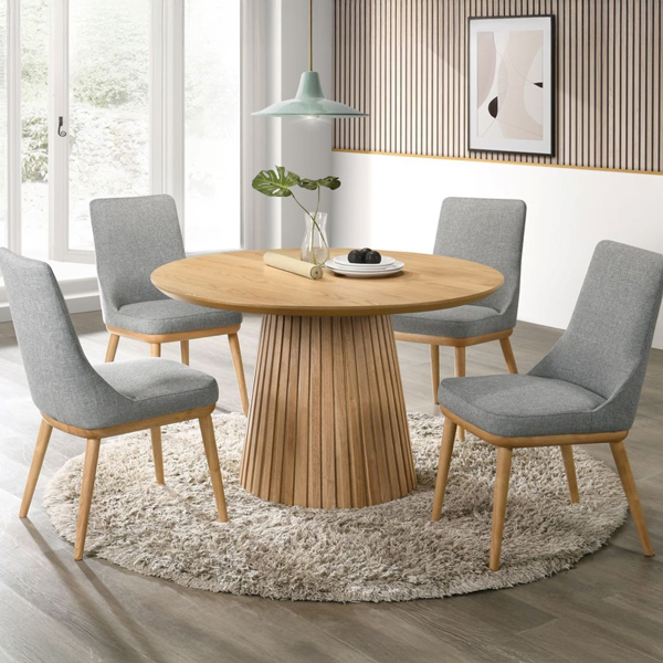 Wooden dining table with grey upholstered chairs