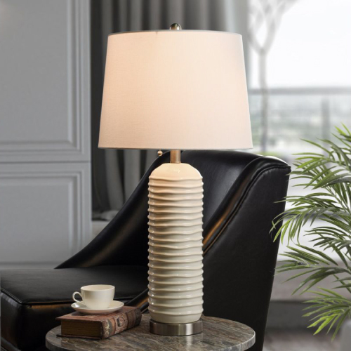 White textured ceramic lamp on a side table